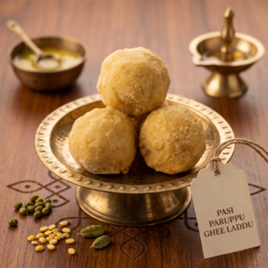 Plate of golden sweet Pasi Paruppu Ghee Laddu traditional South Indian dessert