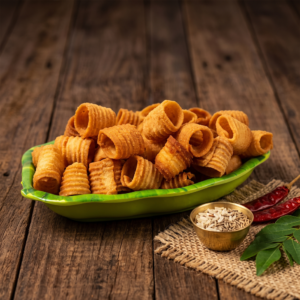 Golden Seepu Murukku served on a traditional banana leaf style platter